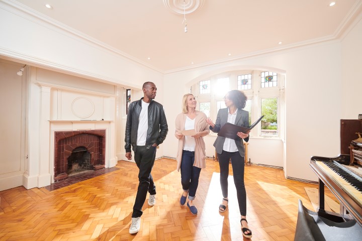 Couple viewing a rental property with the agent