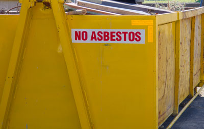 Yellow skip bin with No Asbestos sign